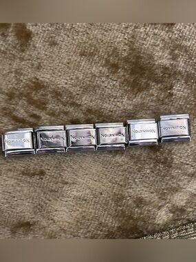 6 Nomination Italian Charms with the word nomination on each